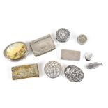 A group of seven white metal small pill boxes and similar items including two circular examples, two