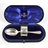 A matched hallmarked silver two-piece christening set, comprising spoon with chased detail to bowl