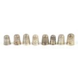 CHARLES HORNER; a group of eight hallmarked silver thimbles including floral banded decorated