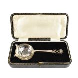ROBERTS & DORE LTD; a George VI hallmarked silver tea strainer with pierced bowl and handle,