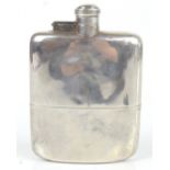 JAMES DIXON & SONS; an early 20th century hallmarked silver hip flask of curved form with screw