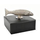 BGB; a contemporary 925 silver mounted paperweight modelled as a fish, raised on a black slate base,