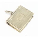 TAYLOR & PERRY; a Victorian hallmarked silver vinaigrette in the form of a book with a cast edge and