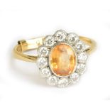 An 18ct yellow gold diamond and citrine floral dress ring (set with a spacer so unable to size),