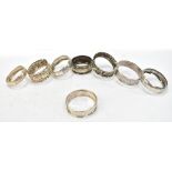 Eight variously hallmarked silver napkin rings, all with engraved foliate decoration, approx 1.
