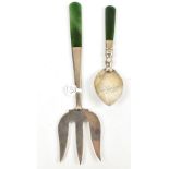 JAMES SWANN & SONS; a George V hallmarked silver nephrite and nephrite handled bread fork,