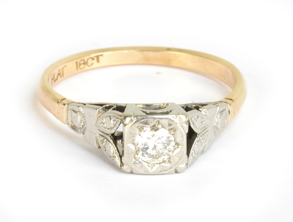 An 18ct yellow gold diamond solitaire ring, the diamond weighing approx 0.20cts and an illusion