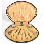 WILLIAM MANTON; a George V and later manicure set with hallmarked silver covers and handles, also