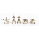 ES BARNSLEY & CO; a George V hallmarked silver five piece cruet set comprising lidded mustard with