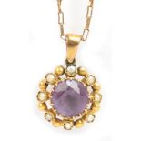 A 9ct yellow gold fine link chain supporting an amethyst and cultured pearl circular pendant, length