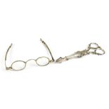 A pair of 19th century white metal spectacles with adjustable arms, indistinctly marked, and a