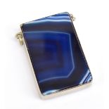 A white metal and agate vesta case of rectangular form, the striking cover 4 x 2.7cm.Additional
