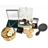 A mixed group of costume jewellery and a large collection of compacts example including swans,