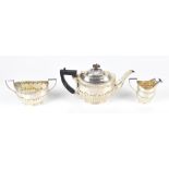 CHARLES HORNER (PROBABLY); an Edward VII hallmarked silver three piece tea service, with gadrooned