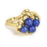 A 14ct gold and simulated lapis lazuli ring with elaborate setting, set with a spacer so unable to