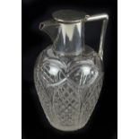 JOHN GRINSELL & SONS LTD; a George V hallmarked silver mounted clear cut glass claret jug,