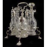 SAMUEL WOOD; a George II hallmarked silver Warwick cruet stand with high loop handle, cinquefoil