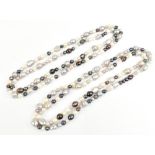 A pair of freshwater pearl tricolour necklaces, each approximately 82cm in length.Additional