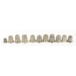 JAMES FENTON & CO; a group of eight hallmarked silver thimbles including a miniature example, also