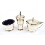 ADIE BROTHERS LTD; a George VI hallmarked silver three piece Art Deco cruet set comprising