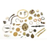 A quantity of costume jewellery including a bangle, brooches, pendants, also a damaged silver