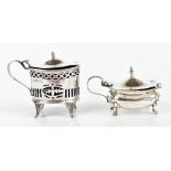 GEORGE LEONARD ALLEN; an Edwardian hallmarked silver lidded salt raised on four scrolling feet,