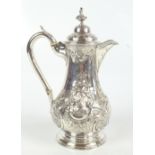 ***WITHDRAWN*** A George III hallmarked silver coffee pot with later embossed decoration, hinged lid