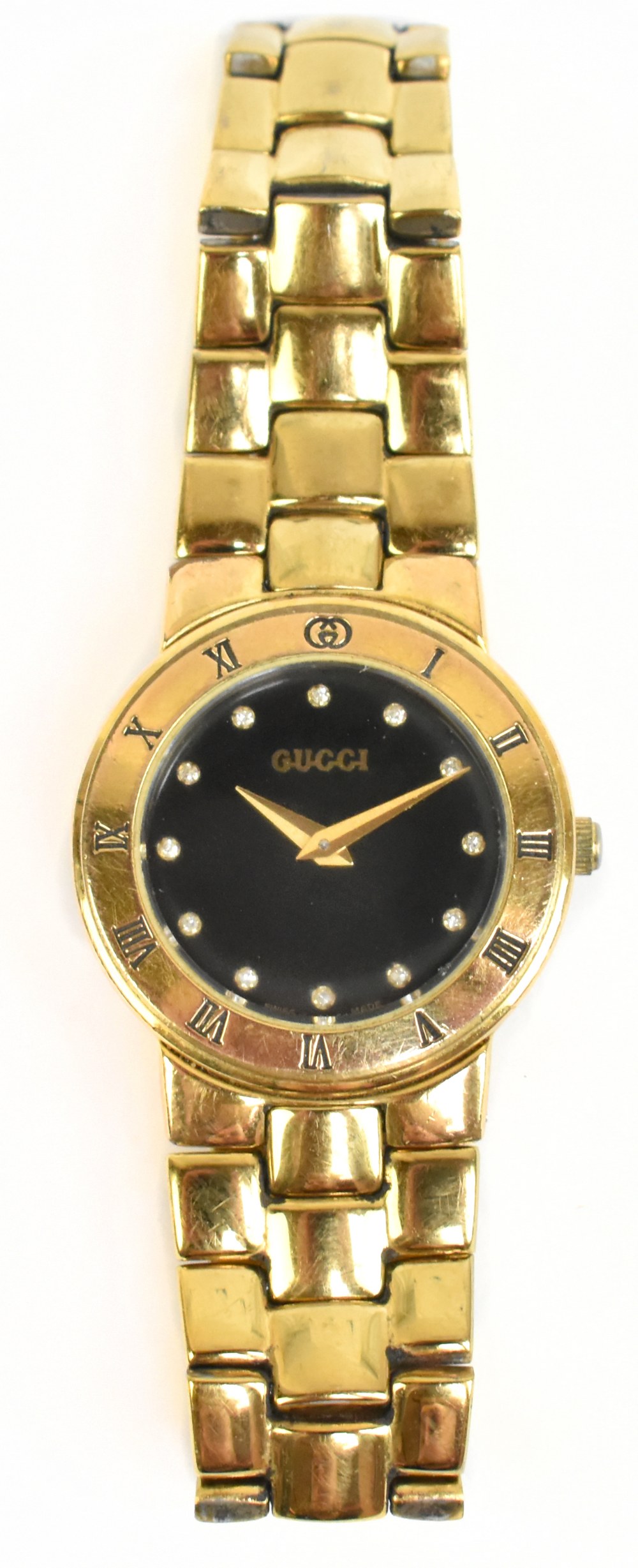 GUCCI; a lady's gold plated 3300L quartz wristwatch, the black dial set with diamond hour markers,