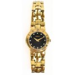 GUCCI; a lady's gold plated 3300L quartz wristwatch, the black dial set with diamond hour markers,