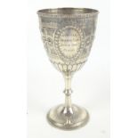 GEORGE UNITE; a late Victorian hallmarked silver trophy goblet cup of Gothic design engraved '