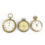 A gold plated crown wind open face pocket watch set with Arabic numerals, a base metal key wind open