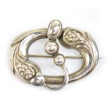 GEORGE JENSEN; a 1960s sterling silver No. 77 brooch of open oval design, stamped to the reverse,