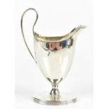 JOHN DOUGLAS; a George III hallmarked silver cream jug with cast liner rims, London 1810, height