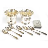 A small group of hallmarked silver items including a pair of Victorian vases with floral rims on