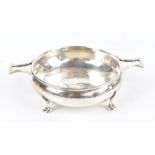 ALBERT EDWARD JONES; a George V hallmarked silver Arts & Crafts twin handled footed bowl with