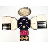 ELKINGTON & CO; a cased set of four salts with beaded rims and scallop moulded spoons, and further
