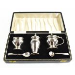 JOSEPH GLOSTER LTD; an Elizabeth II hallmarked silver three piece condiment set comprising lidded