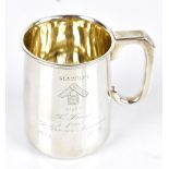 SYNYER & BEDDOES; a George V hallmarked silver christening cup with angle handle and body