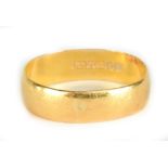 A 22ct yellow gold wedding band, approx 3.1g.Additional InformationThe ring is misshapen and with