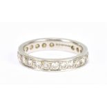 WITHDRAWN A platinum and diamond full eternity ring set with round brilliant cut stones, size K,