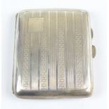 I.S. GREENBERG; a George V hallmarked silver cigarette case of rounded rectangular form,