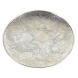 A late 19th/early 20th century Chinese silver circular dish engraved with twin dragons amongst