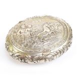 A 19th century French silver tobbaco box of oval form, with repoussé decoration depicting a