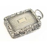 TAYLOR & PERRY; a William IV hallmarked silver vinaigrette of rounded rectangular form, with a