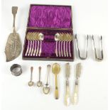 A group of hallmarked silver items including a Victorian fish slice, Exeter 1837, two pairs of sugar