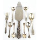 A small group of variously hallmarked silver spoons, a single fork and a sheaf handled cake slice,