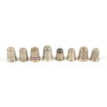 CHARLES HORNER;  a group of eight hallmarked silver thimbles including a red, white and blue