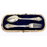 JOHN GILBERT; a Victorian hallmarked silver christening fork and spoon set, with chased and cast