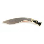 An 18ct yellow gold silver and black enamelled brooch in the form of a Gurkha's kukri knife,