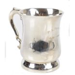 TANDY & SONS; a George VI hallmarked silver mug with scrolling loop handle and shaped body inscribed